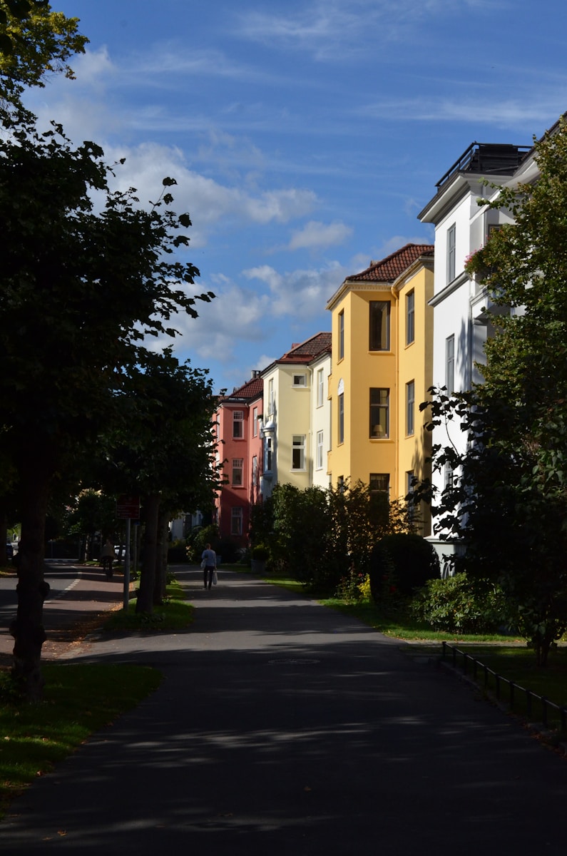 a person riding a bike down a street