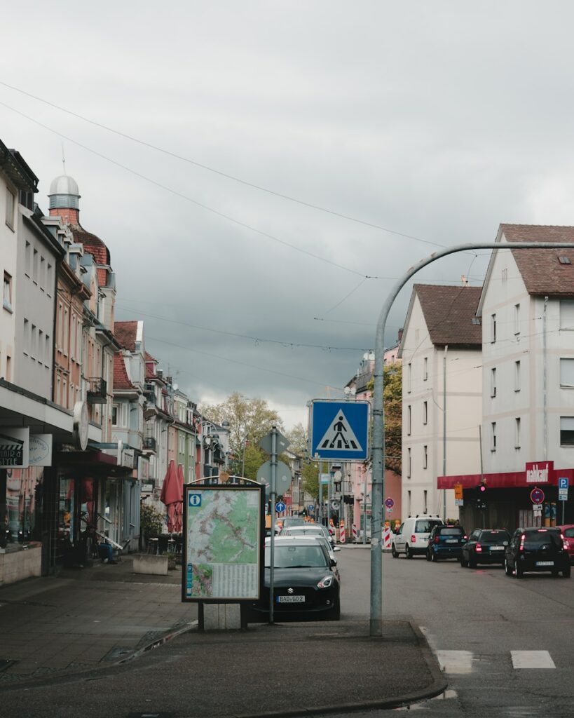 A street scene with buildings and traffic.