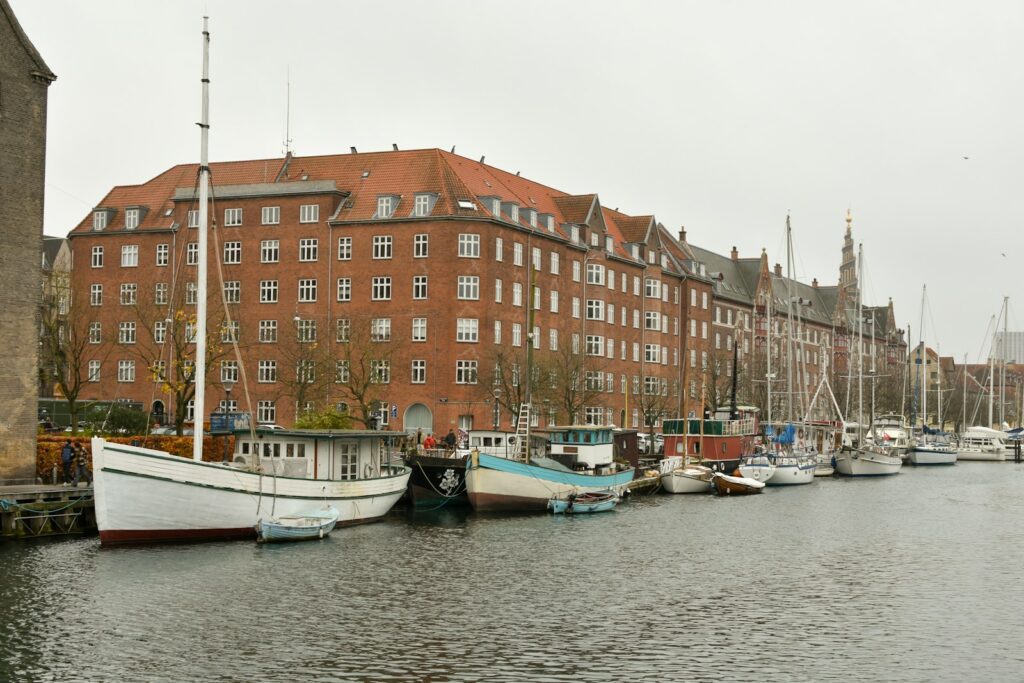 A row of boats sitting next to each other on a body of water