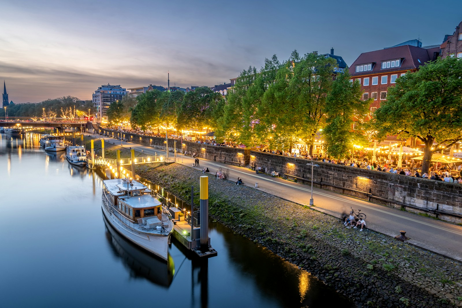 A river that has a bunch of boats in it